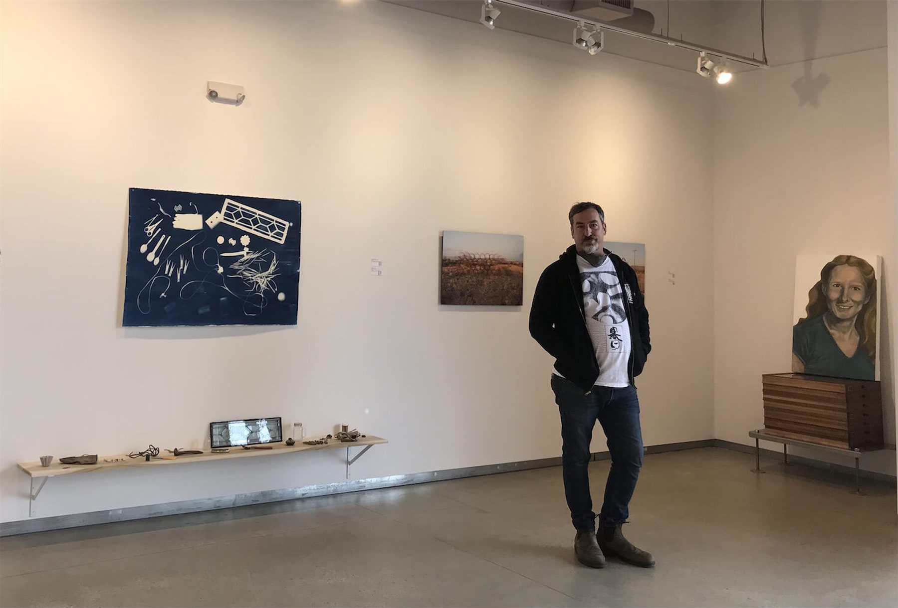 Nathan Byrne, standing within his exhibition NEW POINT OF BEGINNING at Roy G Biv Gallery in Columbus, Ohio.