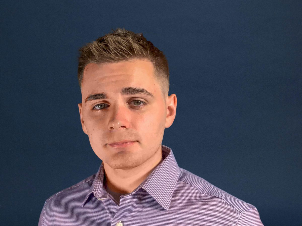 Colin Hunter, wearing a purple button-down shirt