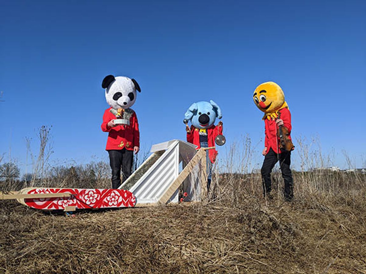 people dressed up in animal mascot costumes