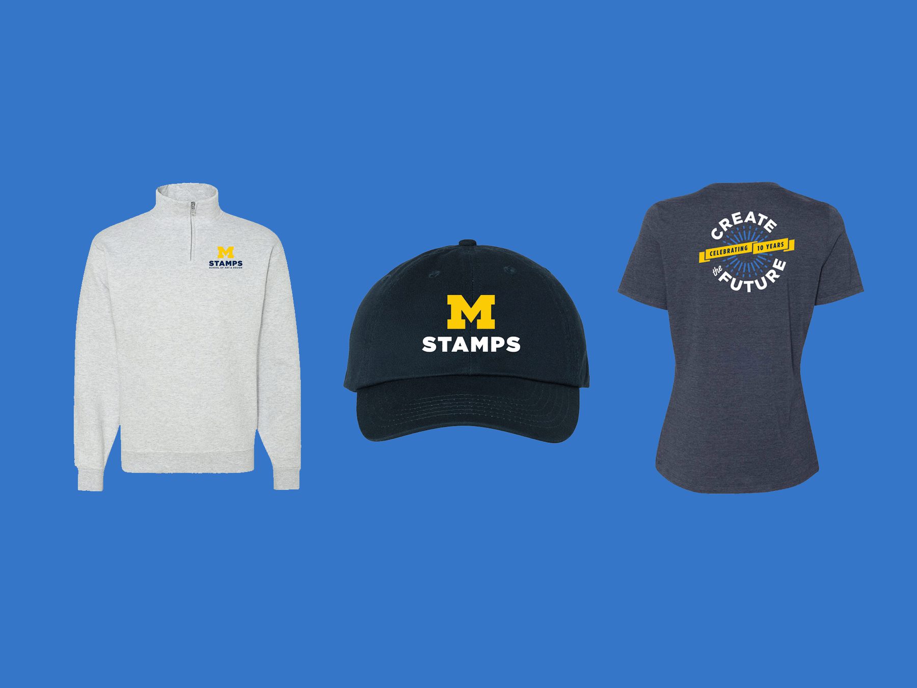 Gray stamps pullover with logo, navy baseball cap with logo, and heather blue t-shirt with 10th anniversary Stamps logo
